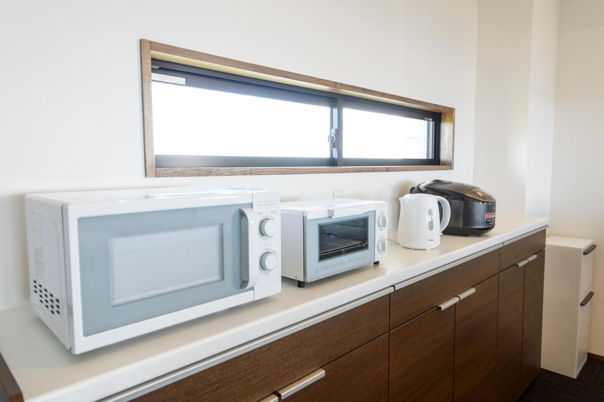 Apartment ホテルコンドミニアム土花土花 Onna